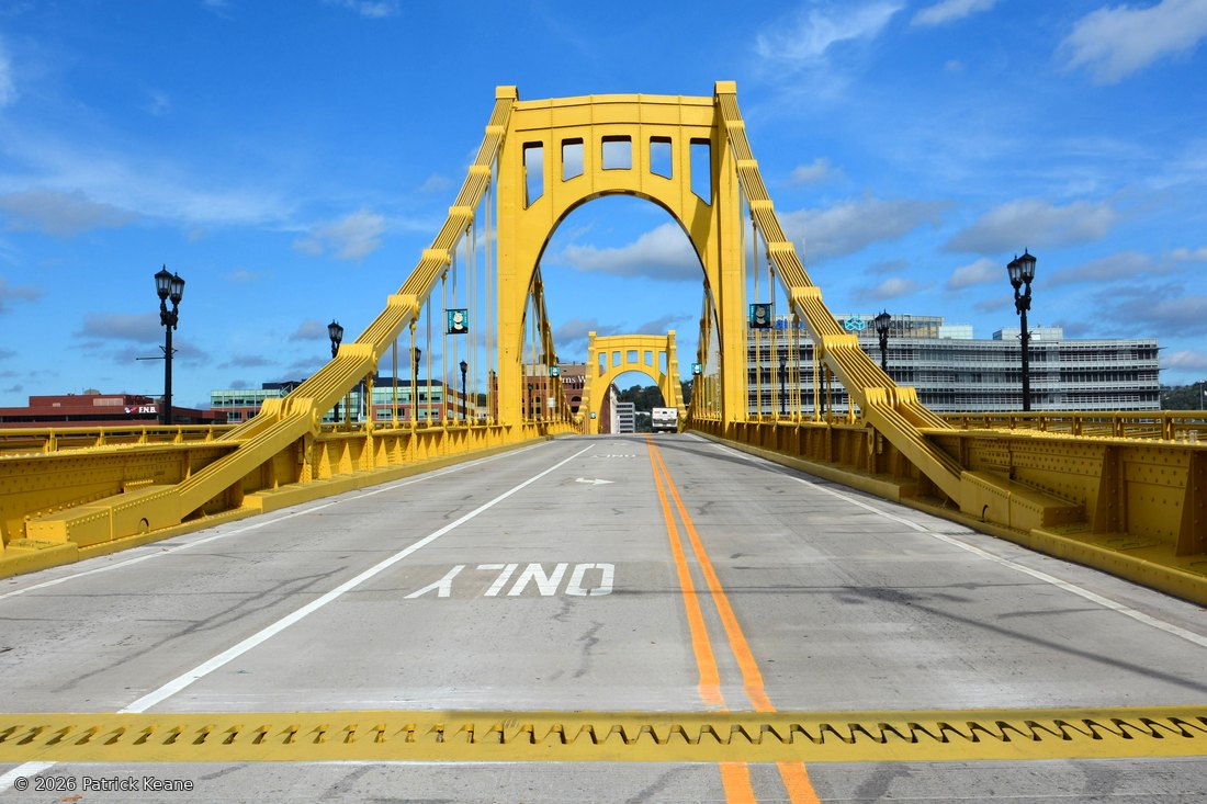 The Roberto Clemente Bridge, empty and freshly painted, from the deck
